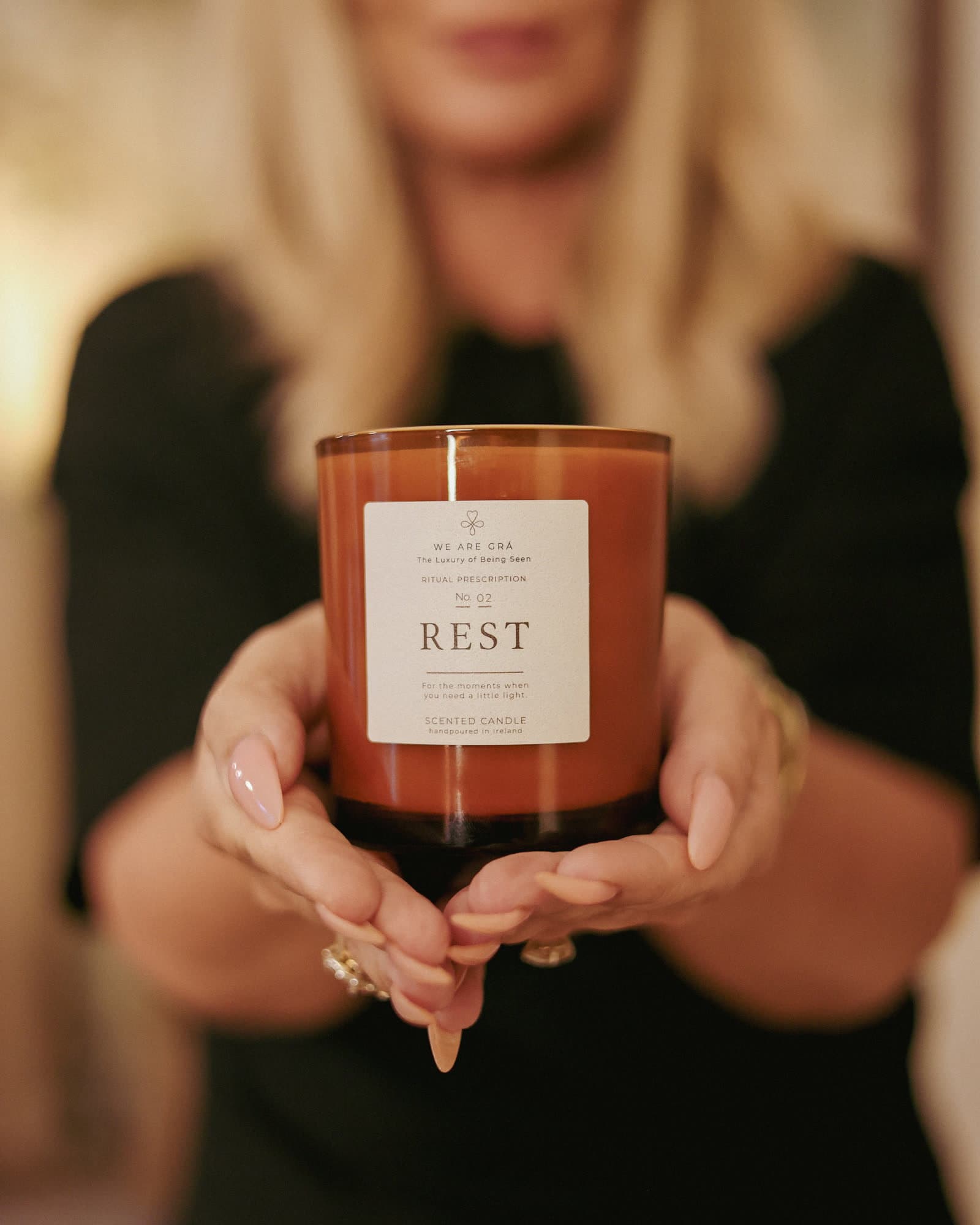 Shawna Mallon holding the Rest candle from We Are Grá.